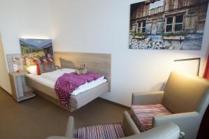 Postel nebo postele na pokoji v ubytování Hotel Edel Weiss