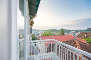 a balcony with a view of a city at Mỹ Kim Villa in Da Lat