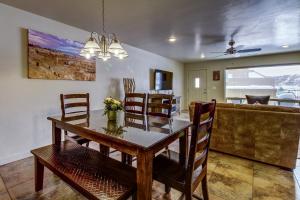 a dining room with a wooden table and chairs at Rim Vista 9A8 in Moab