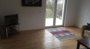 Μια τηλεόραση ή/και κέντρο ψυχαγωγίας στο Ferienwohnungen Elvano