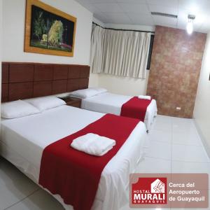 Voodi või voodid majutusasutuse Hotel Murali - Cerca del Aeropuerto de Guayaquil toas