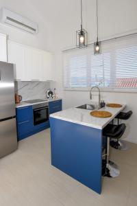 Kuchyň nebo kuchyňský kout v ubytování Apartments Villa Laura