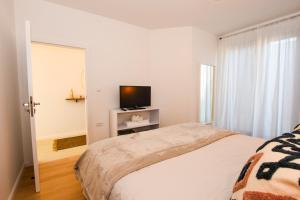 Postel nebo postele na pokoji v ubytování Apartments Villa Laura