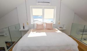 Postel nebo postele na pokoji v ubytování Apartments Villa Laura