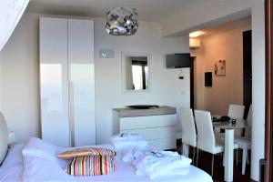 a bedroom with a bed and a table and a tableablish at Villa Sofia in Taormina