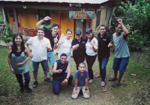 a group of people posing for a picture in front of a house at Hostal Familiar El Ángel Panamá B&B in Pajonal Arriba