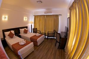 Uma cama ou camas num quarto em Waterfront Resort by KGH Group