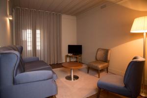 Uma área de estar em Hotel da Oliveira