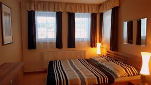 Postel nebo postele na pokoji v ubytování Lipno Apartmany Frymburk III.
