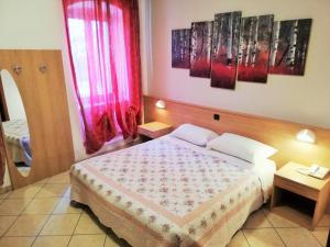 Postel nebo postele na pokoji v ubytování Albergo Neni