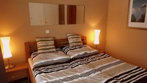 Postel nebo postele na pokoji v ubytování Lipno Apartmany Frymburk III.
