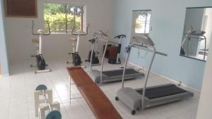 a gym with several exercise bikes in a room at Sun Valley Hotel in Campo do Meio