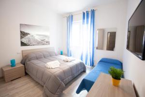 a bedroom with a bed and a table in it at New Tiburtina in Rome