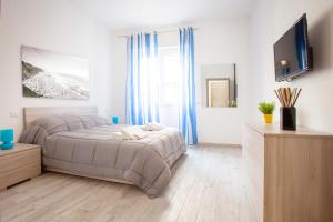 a bedroom with a bed and a television in it at New Tiburtina in Rome