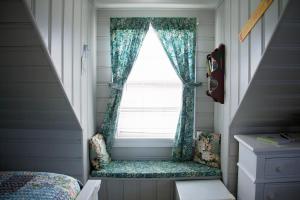 a bedroom with a window and a bed at Atlantic House Bed & Breakfast in Ocean City