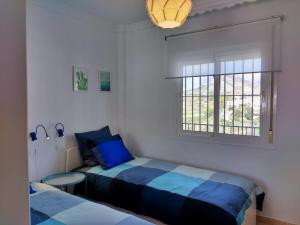 A bed or beds in a room at Apartamento Picasso