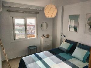 A bed or beds in a room at Apartamento Picasso