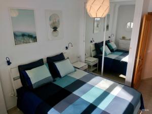 A bed or beds in a room at Apartamento Picasso
