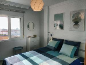 A bed or beds in a room at Apartamento Picasso