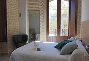 Postel nebo postele na pokoji v ubytování Apartamentos Reyes Catolicos 14