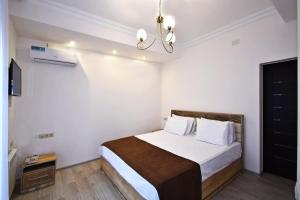 Voodi või voodid majutusasutuse Patriott Hotel toas