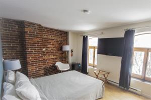 TV a/nebo společenská místnost v ubytování Hotel Belley