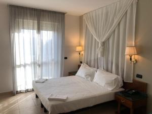 Postel nebo postele na pokoji v ubytování Ariae Dépendance - Alihotels
