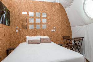 Uma cama ou camas num quarto em Natura Glamping