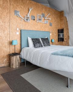 Uma cama ou camas num quarto em Natura Glamping