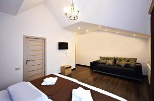 Voodi või voodid majutusasutuse Patriott Hotel toas