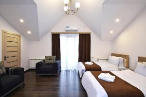 Voodi või voodid majutusasutuse Patriott Hotel toas