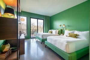 Voodi või voodid majutusasutuse The Ruby Hotel toas
