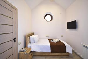 Voodi või voodid majutusasutuse Patriott Hotel toas