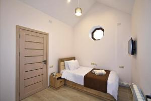 Voodi või voodid majutusasutuse Patriott Hotel toas