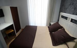 Postel nebo postele na pokoji v ubytování Hostal Centro