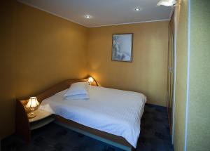 Ένα ή περισσότερα κρεβάτια σε δωμάτιο στο Valencia Hotel