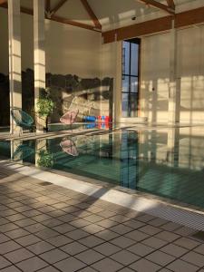 a swimming pool in the middle of a building at Skjolden Hotel in Skjolden