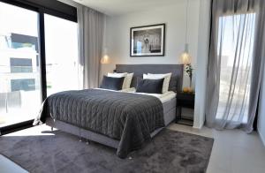 Postel nebo postele na pokoji v ubytování Exclusive Villa Campoamor by NRAS