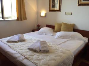 Postel nebo postele na pokoji v ubytování Apartments Šulekić