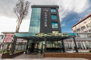 a building with a sign on the front of it at Sky Corner Hotel in Ohrid