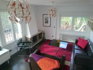 a living room with a couch and a table at Piedra Libre Apartamentos in Manzanares el Real