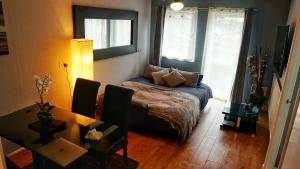 a living room with a couch and a table at North London Apartment - Edmonton in Edmonton