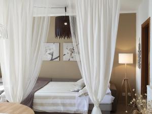 Postel nebo postele na pokoji v ubytování Suite Riomaggiore