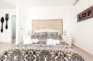 Posteľ alebo postele v izbe v ubytovaní Ortigia Terrace Sea View