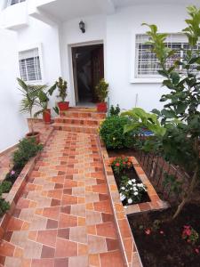 a brick walkway in front of a house at TANJITAN HOSPITALITE in Tangier