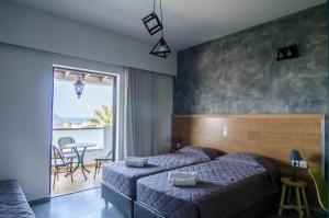Postel nebo postele na pokoji v ubytování Nireas Hotel