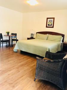 Postel nebo postele na pokoji v ubytování Bella Capri Inn and Suites