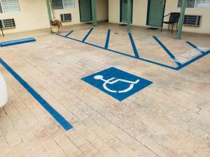 a floor with blue signs on the floor of a building at Bella Capri Inn and Suites in Camarillo