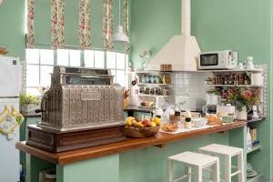 a kitchen with a counter with a scale on it at Casa Chacabuco Tandil in Tandil