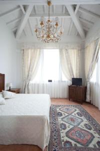 Säng eller sängar i ett rum på Villa Cristina